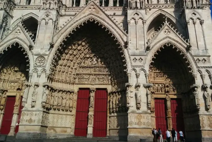 Tourists wander around Amiens cathedral